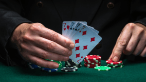 Holding casino chips and playing cards