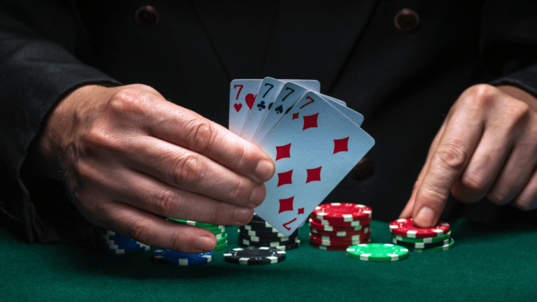 Holding casino chips and playing cards